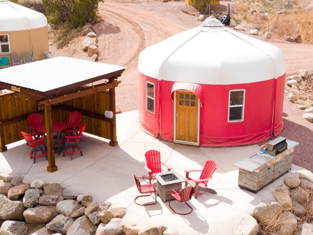 Riverside yurt lodging along the Arkansas River at sunset